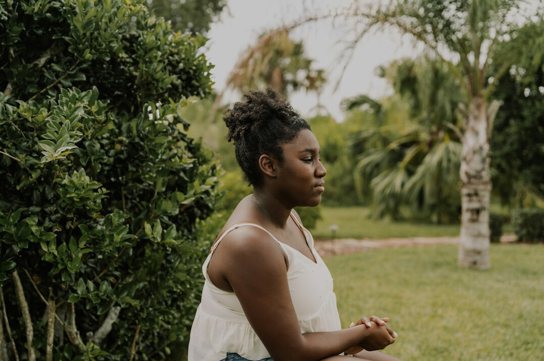 woman meditating in peaceful nature
